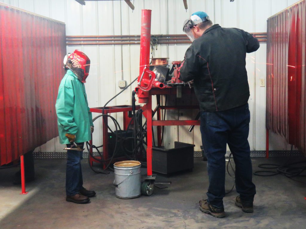 youth learn how to weld at felling trailers